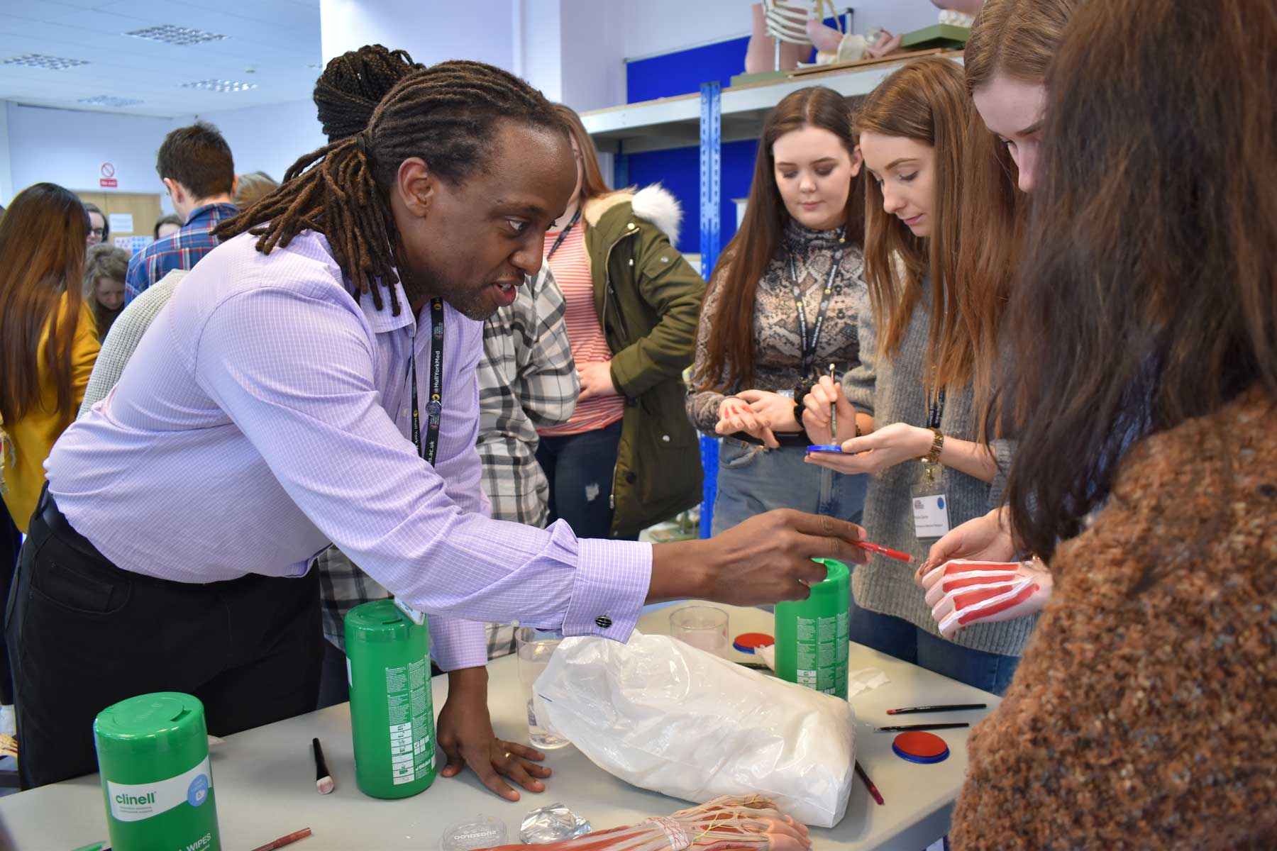 Professor Peter Bazira and school students in the anatomy lab