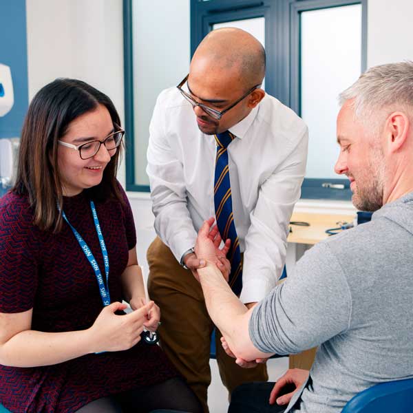 Medicine student and a GP with a patient at Brough GP Surgery