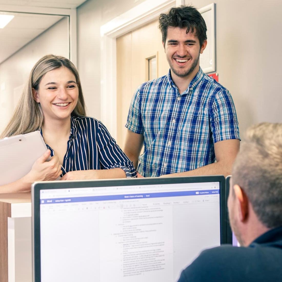 Students chatting to a member of the Student Liaison Team at Hull Royal Infirmary