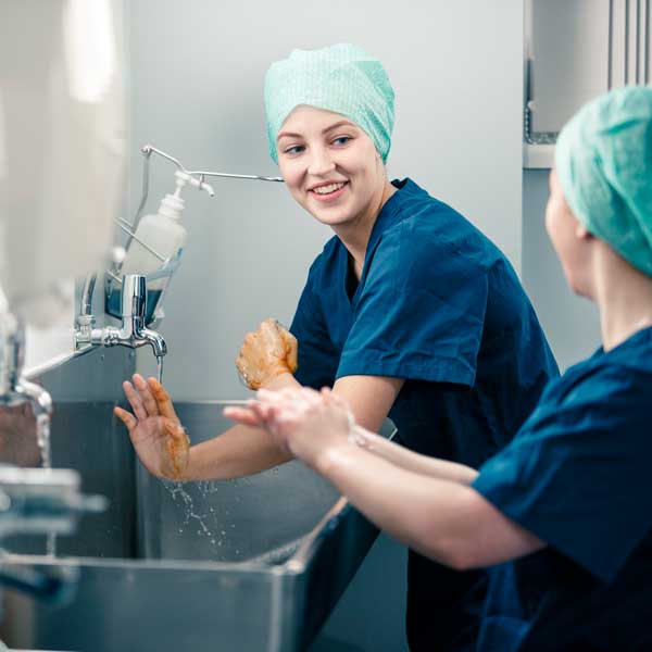 Students scrubbing up for surgery