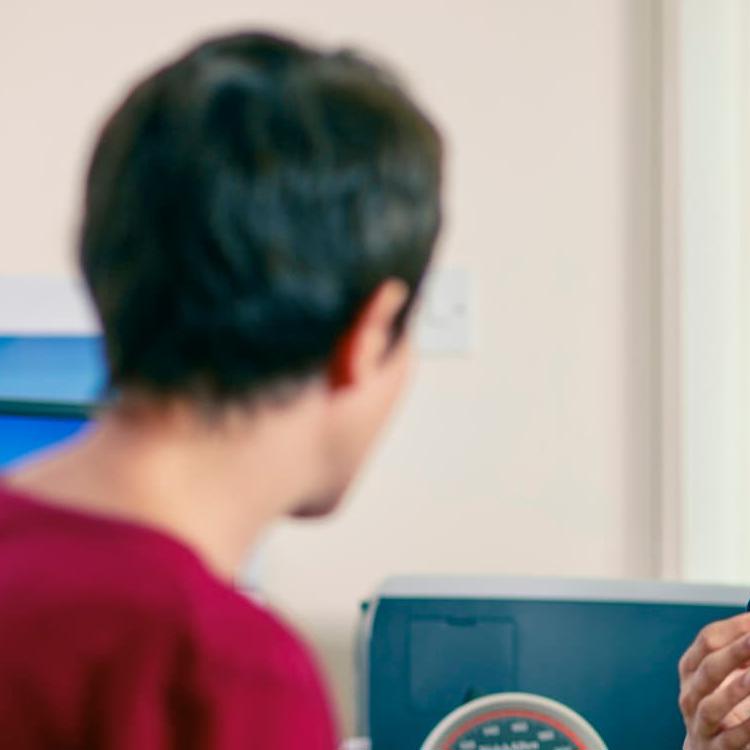 A GP talking to a patient in a consultation room