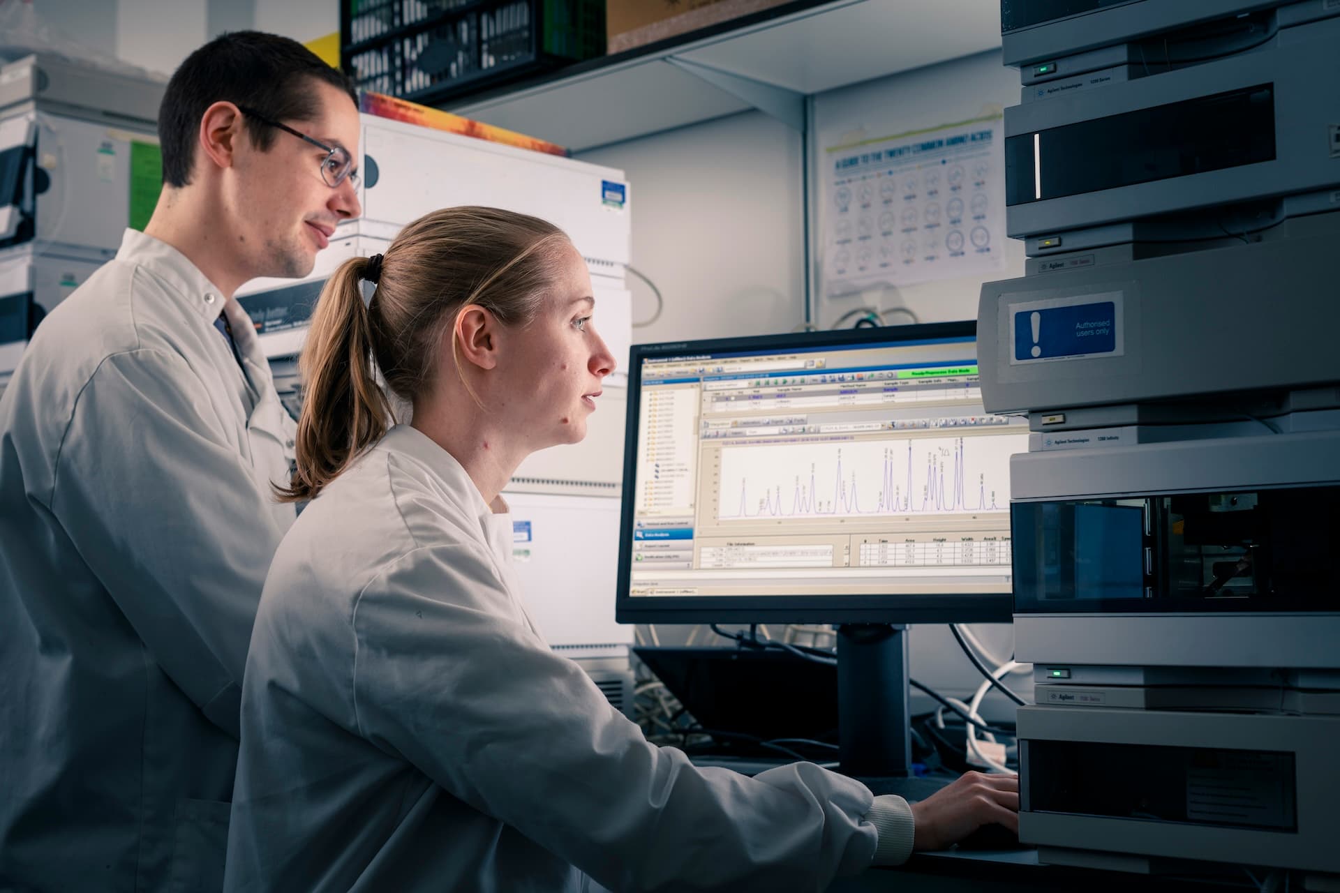 Pharmacology students working on a computer in a lab