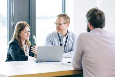 Members of the Academy of Primary Care in discussion around a table