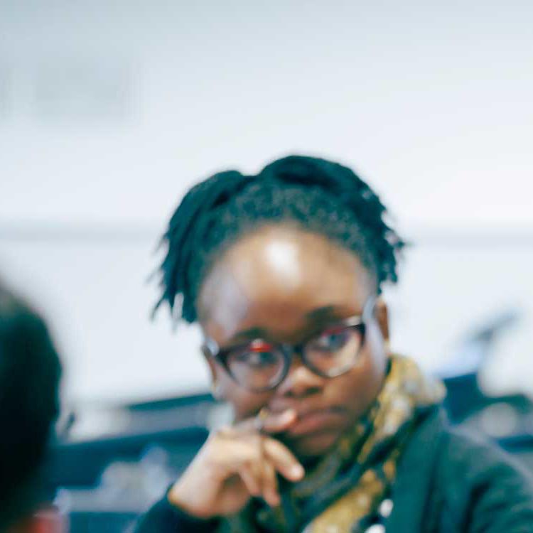 Health Professions Education tutor and students in discussion
