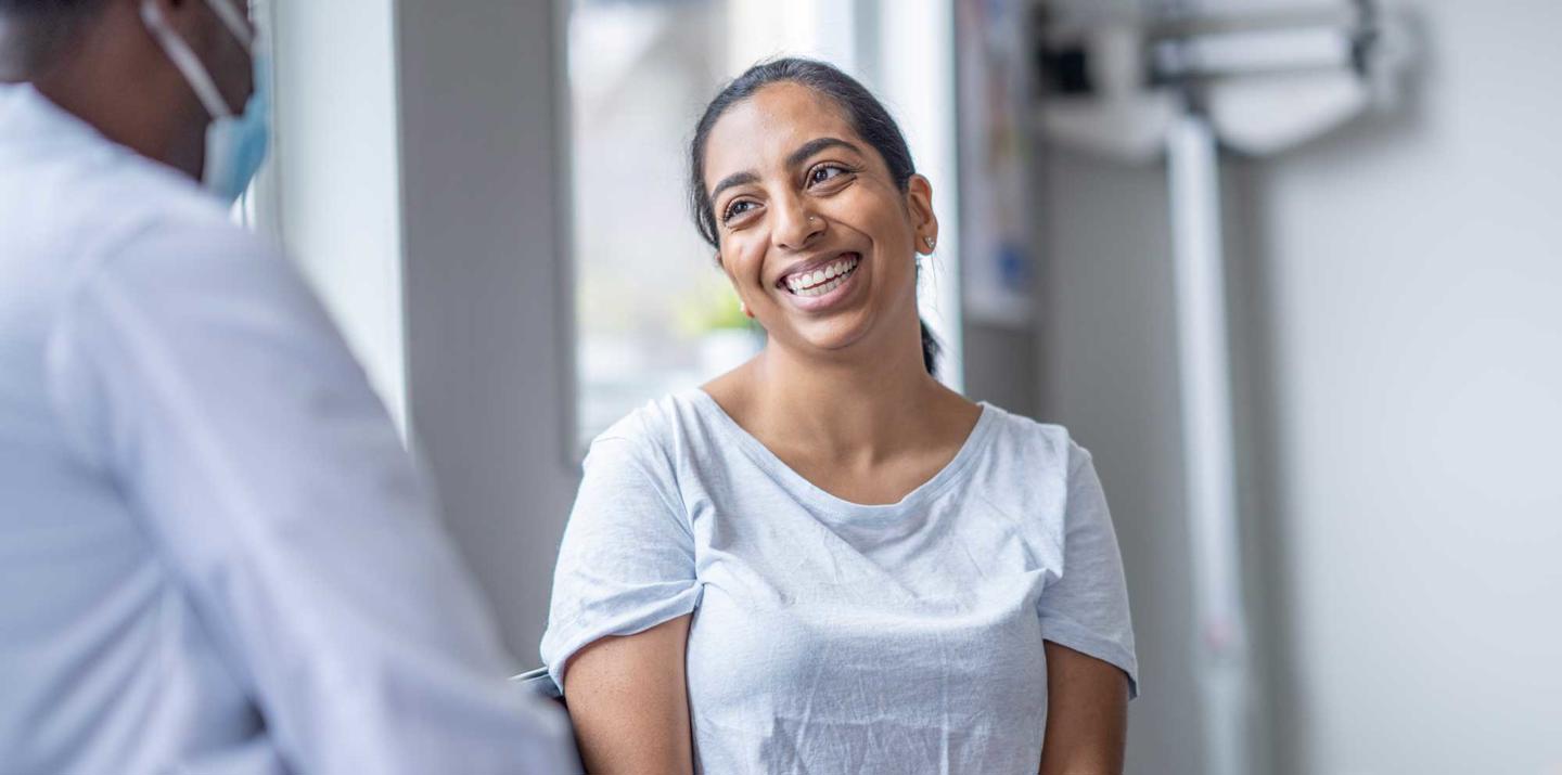 Patient smiling at doctor