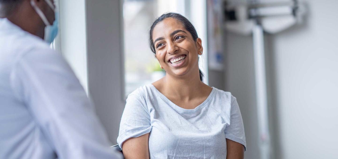 Patient smiling at doctor