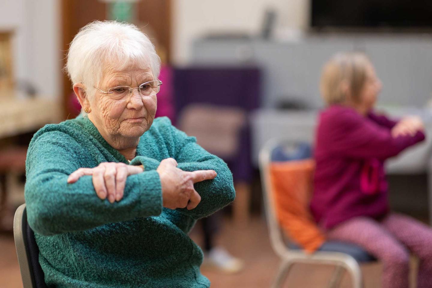 Older lady in exercise class