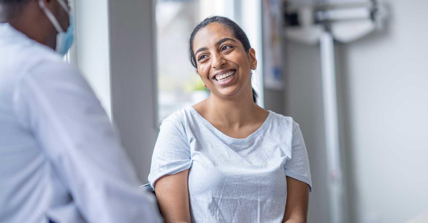 Patient smiling with a doctor