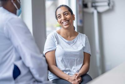 Patient smiling with a doctor