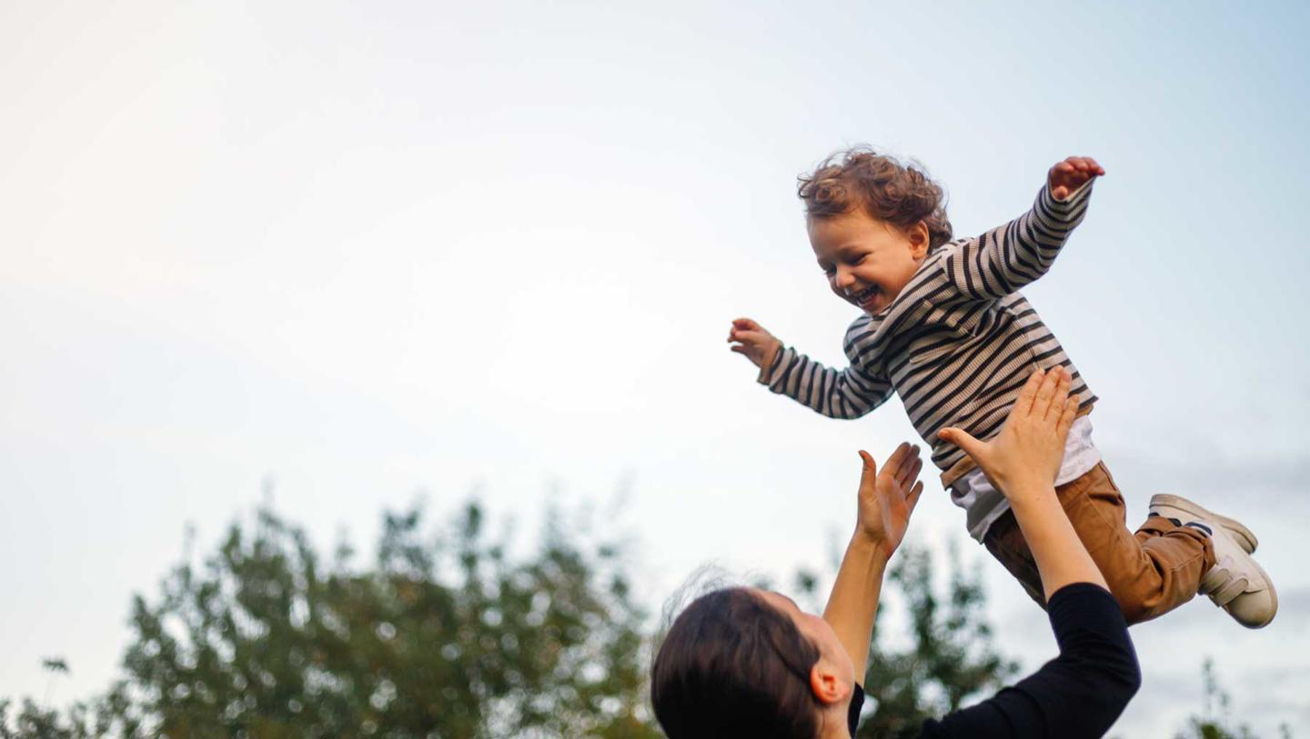 Mum throws a child into the air