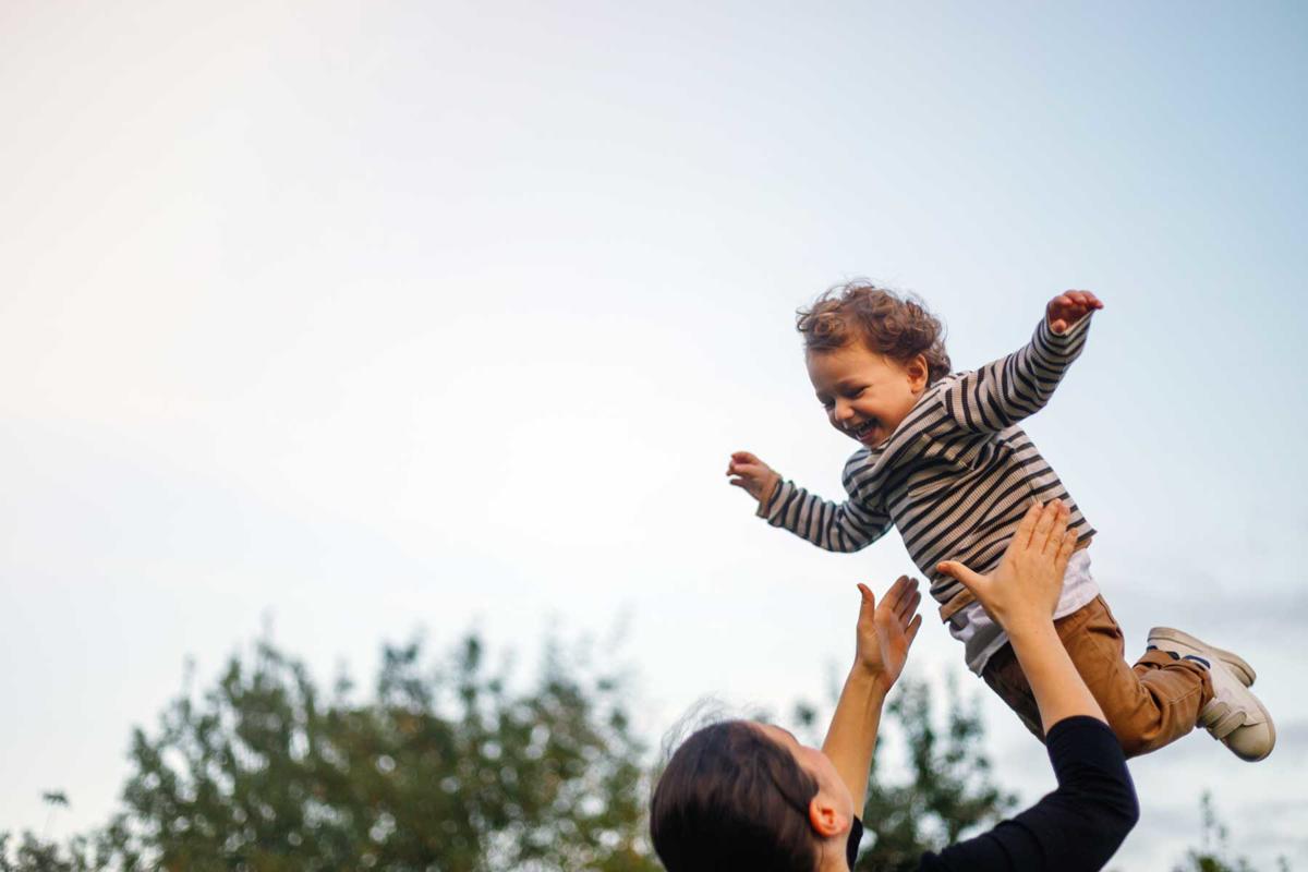 Mum throws a child into the air